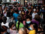 A long queue is formed outside a medical supply store that sells face masks, a day after Philippine government confirmed first novel coronavirus case, in Manila, Philippines