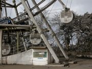 A ferris wheel is covered with volcanic ash in a park in Tagaytay City
