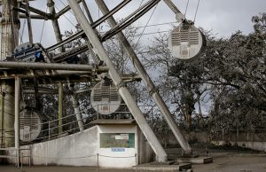A ferris wheel is covered with volcanic ash in a park in Tagaytay City