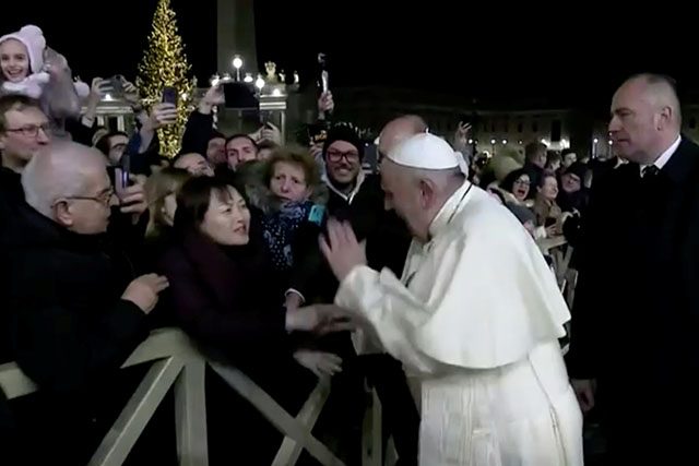 Pope Francis with a woman