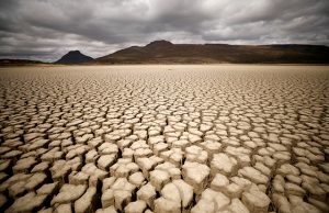 Clouds gather but produce no rain as cracks are seen in the dried up municipal dam in drought-stricken Graaff-Reinet