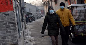 Beijing residents wearing face masks