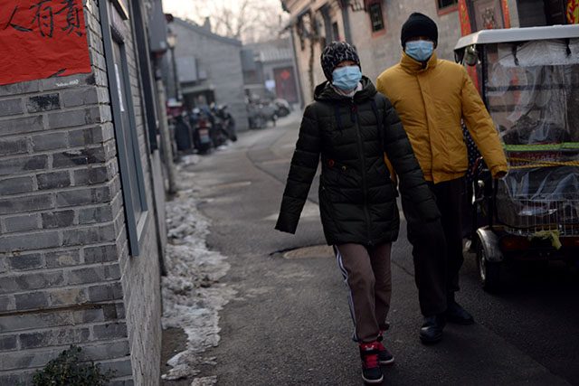 Beijing residents wearing face masks