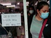 Latest on the coronavirus spreading in China and beyond A sign is posted on a medical supply store that says surgical and N95 masks are already out of stock, in Manila,