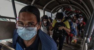 Commuter wearing face mask