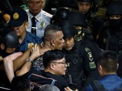 Archie Paray, the gunman and former security guard who took dozens hostage inside a mall, is arrested by police in San Juan, Metro Manila