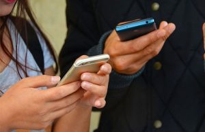 Youth using smartphones