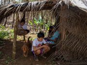 Scaling roofs and mountains, Filipino students battle to take online classes