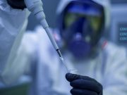 COVID variants: We spoke to the experts designing a single vaccine to defeat them all Worker in laboratory