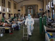 Why Filipinos want to continue receiving DOH’s daily COVID-19 cases updates Medical worker in PPE suit