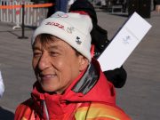 Actor Jackie Chan carries Olympic torch atop Great Wall