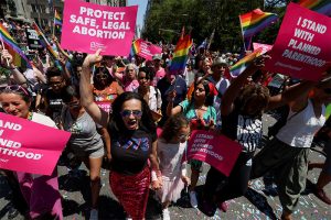 Abortion ruling casts cloud over usual cheer at U.S. Pride parades