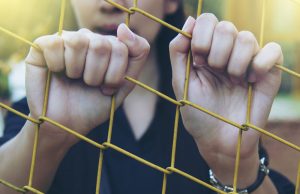 Girl in a cage