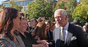 King Charles greeting people