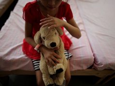 Child with stuffed toy_UNICEF