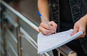 Student taking notes