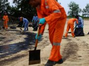 Singapore intensifies oil spill clean up after it spreads along coast