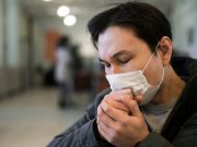 First aid tips vs asthma attack due to vog Coughing man