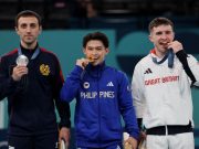 Olympic medal biting: Real reason behind the photo-worthy tradition Carlos Yulo biting medal