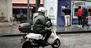 Motorcycle rider in rain