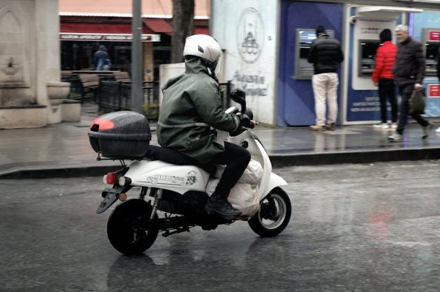 Motorcycle rider in rain