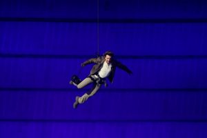 Tom Cruise stunt caps handing of Olympic flag to Los Angeles