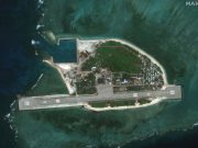 China’s military says it’s conducting patrols around disputed shoal in South China Sea