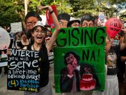 Supporters and detractors of Duterte rally on his 80th birthday