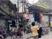 Throwback: Manila residents hang their clothes out to dry on city’s phone lines