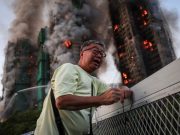 The photo that became a symbol for Hong Kong’s deadly fire