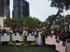Mourners flock to site of deadly Hong Kong blaze as Beijing warns against protests