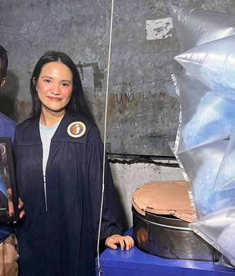 Atenean graduate honors father, cotton candy vendor, for helping her finish college