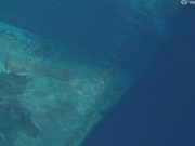 Satellite images show suspected structure at disputed South China Sea atoll, but later gone